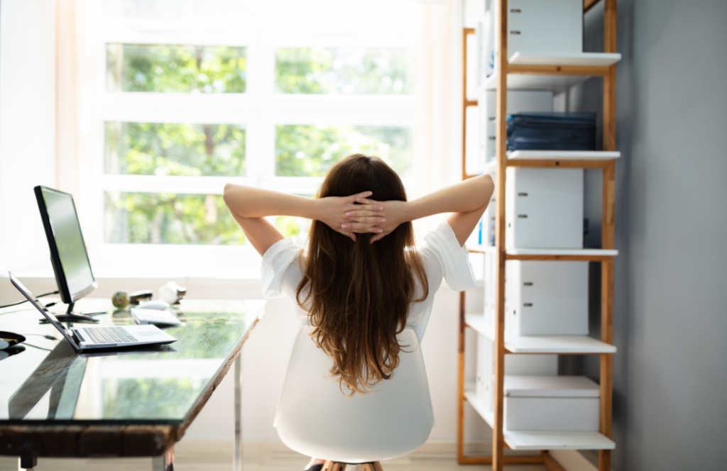 a woman sits back and relax to reduce stress from work